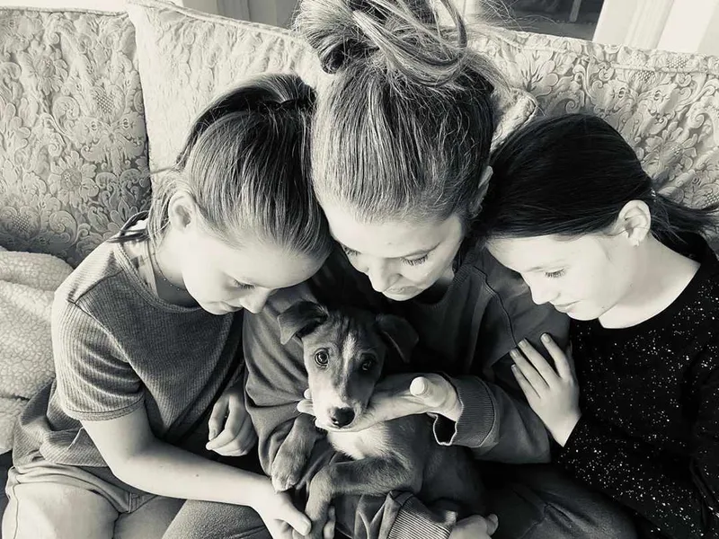 Lisa Marie with family fostering a dog
